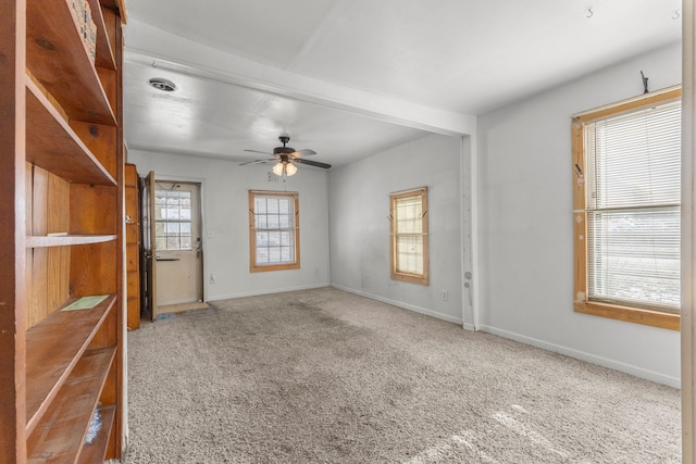 spare room with ceiling fan and carpet floors