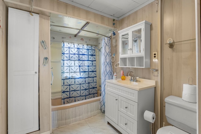 full bathroom with vanity, toilet, ornamental molding, and shower / tub combo with curtain