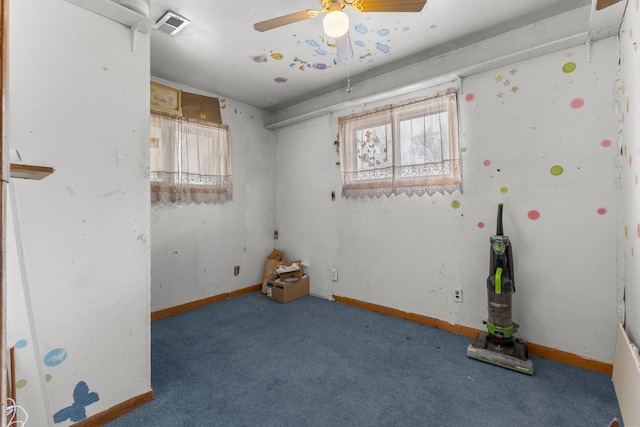 spare room with ceiling fan and carpet flooring