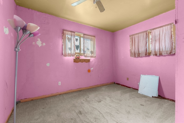 empty room with light carpet and ceiling fan