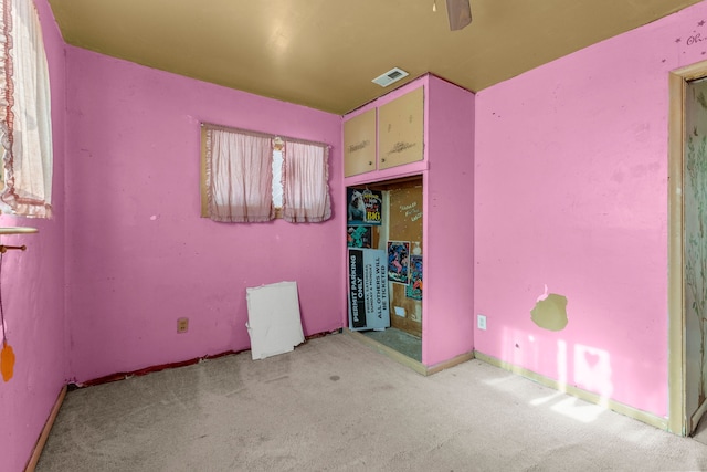 unfurnished bedroom with light colored carpet