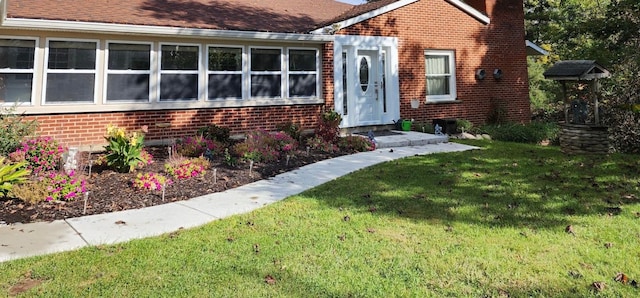 entrance to property with a yard