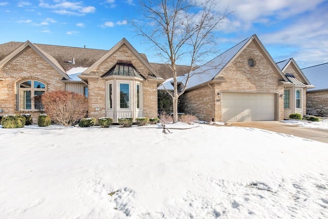 view of front of property with a garage