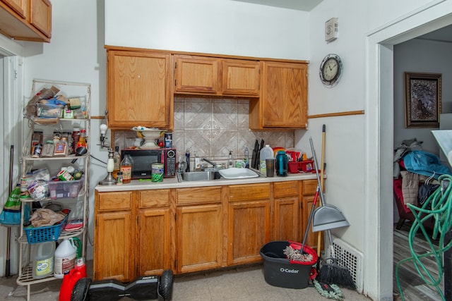 kitchen featuring sink and backsplash