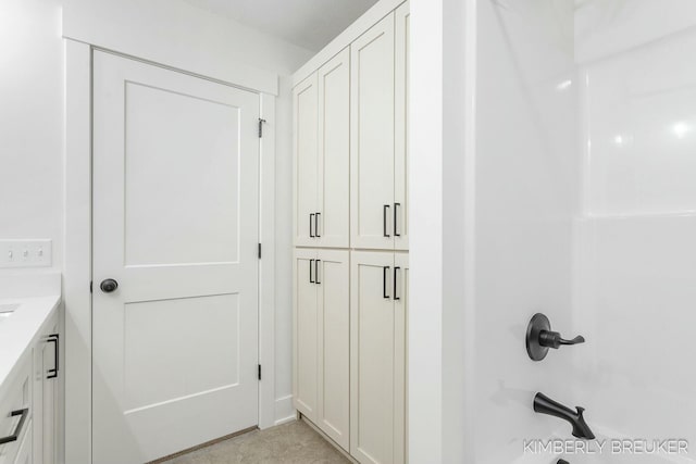 bathroom featuring vanity and shower / bath combination