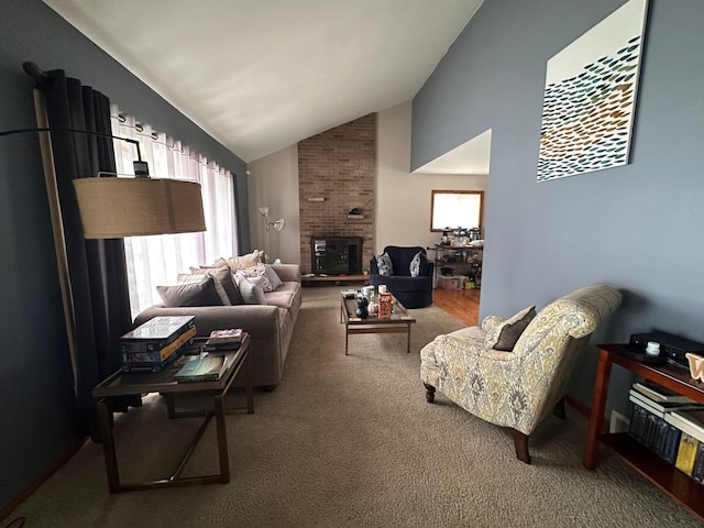 carpeted living room featuring a brick fireplace and lofted ceiling