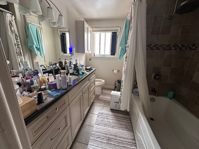 full bathroom with tile patterned floors, vanity, toilet, and shower / tub combo with curtain