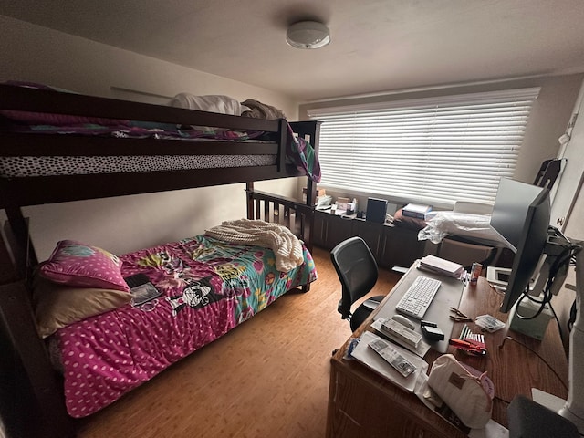 bedroom with hardwood / wood-style floors