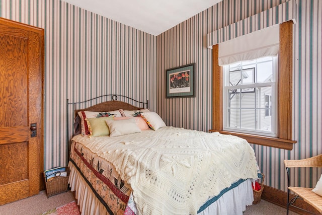 carpeted bedroom featuring wallpapered walls