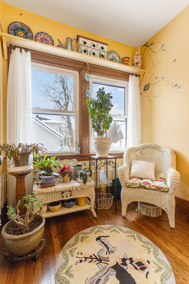 sitting room featuring wood finished floors