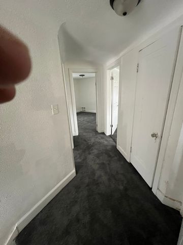 corridor with dark carpet