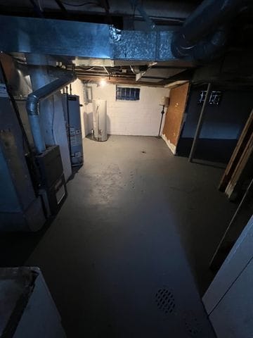 basement featuring water heater