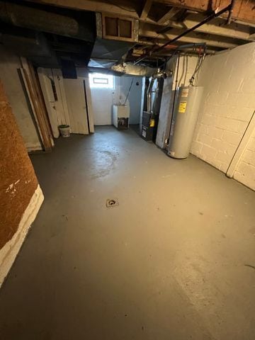 basement with heating unit and water heater