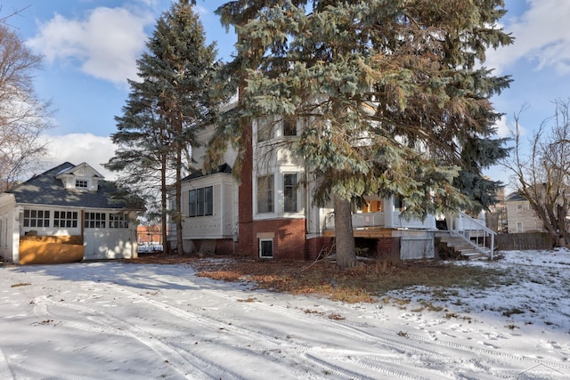 view of front of home with an outdoor structure and a garage