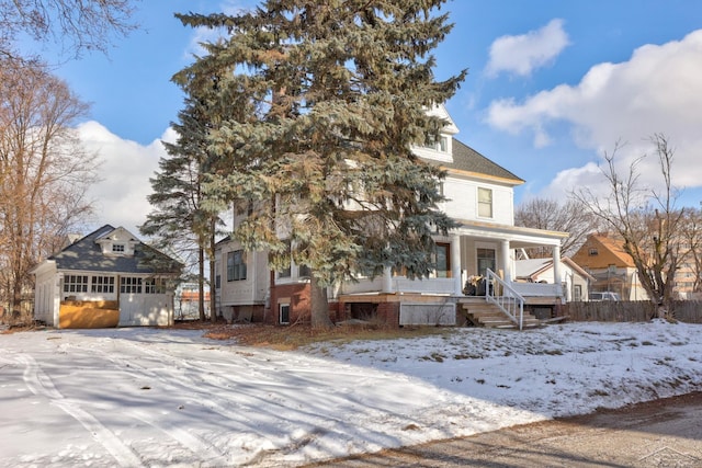 view of front facade featuring a garage and a porch