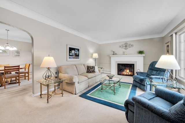 carpeted living room with an inviting chandelier and a baseboard radiator