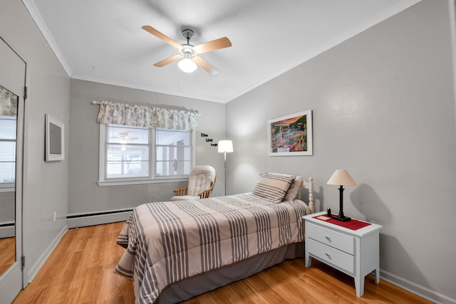 bedroom featuring crown molding, ceiling fan, baseboard heating, and light hardwood / wood-style floors