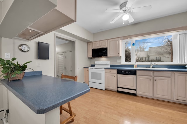 kitchen featuring sink, paneled dishwasher, white electric range oven, kitchen peninsula, and light wood-type flooring