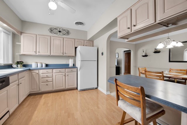 kitchen featuring sink, dishwashing machine, light hardwood / wood-style floors, white fridge, and ceiling fan with notable chandelier