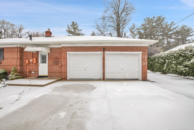 view of snow covered garage