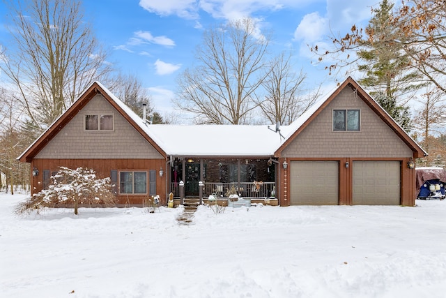 view of front facade with a garage and a porch