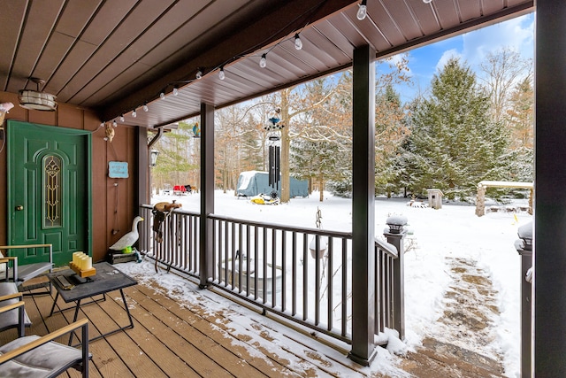 view of snow covered deck