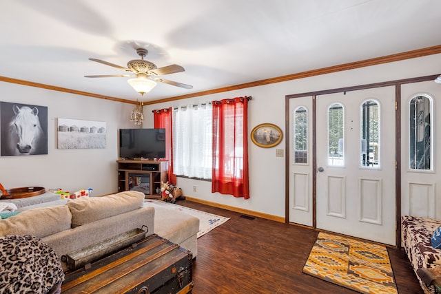 living room featuring crown molding, plenty of natural light, dark wood-type flooring, and ceiling fan