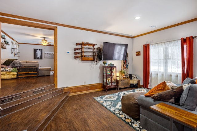 living room with wood-type flooring, ornamental molding, and ceiling fan