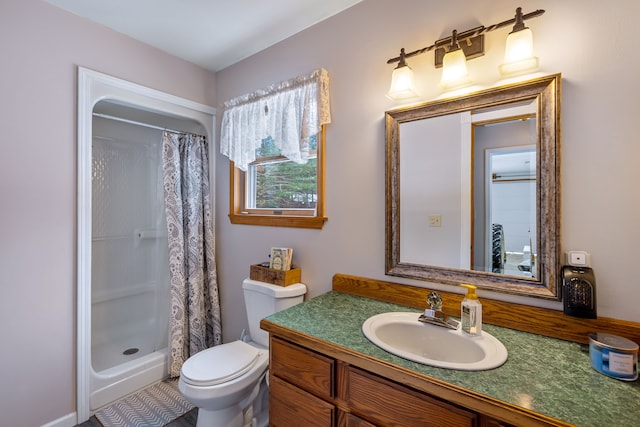 bathroom with vanity, toilet, and a shower with shower curtain