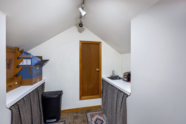 bonus room featuring sink and vaulted ceiling