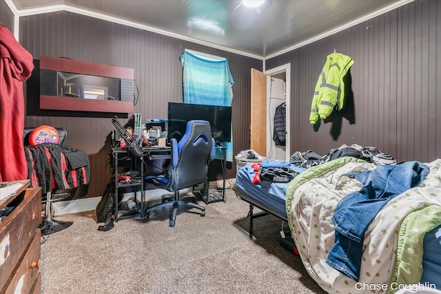 carpeted bedroom featuring ceiling fan and ornamental molding