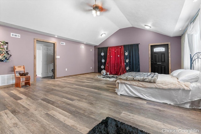 bedroom featuring lofted ceiling, hardwood / wood-style floors, and ceiling fan