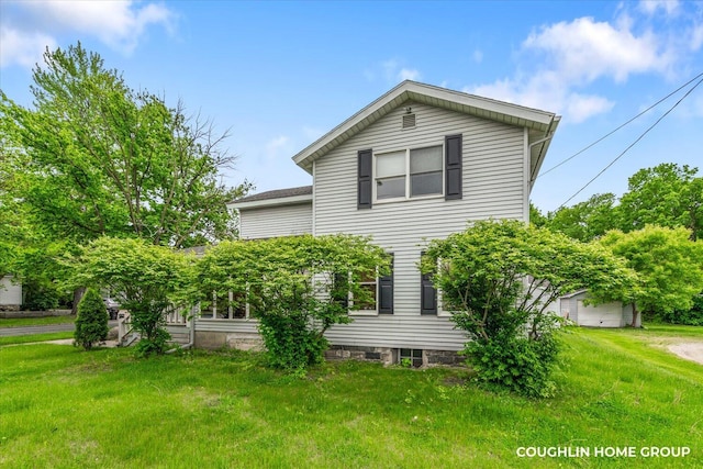502 W State St, Hastings, MI 49058 - view of side of home with a yard