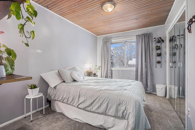 carpeted bedroom featuring crown molding and wooden ceiling