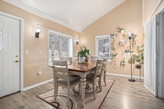 dining space featuring wood ceiling, light hardwood / wood-style flooring, and lofted ceiling