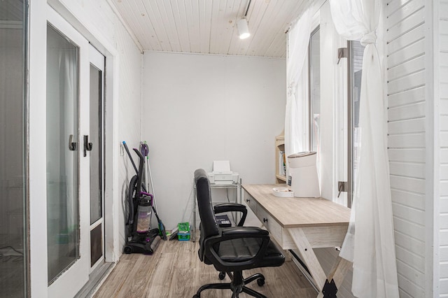 home office featuring light hardwood / wood-style floors and wood ceiling