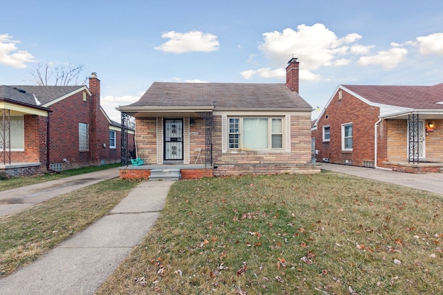 bungalow with a front yard