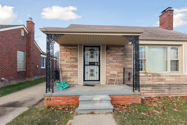 doorway to property with covered porch