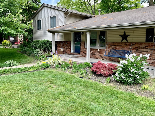 exterior space with a porch and a lawn