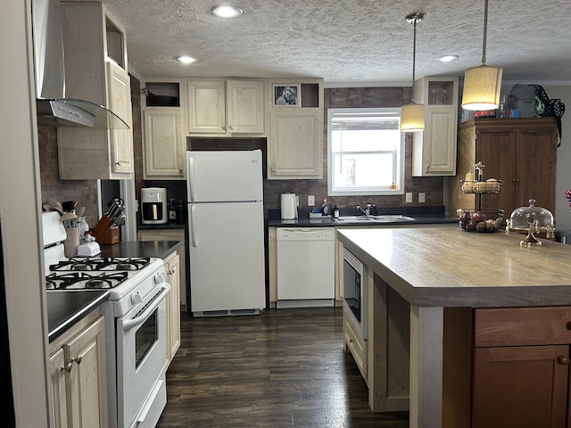 kitchen with sink, decorative light fixtures, white appliances, a textured ceiling, and wall chimney range hood