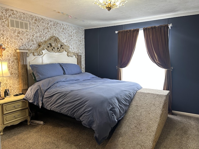 bedroom with dark carpet and a textured ceiling