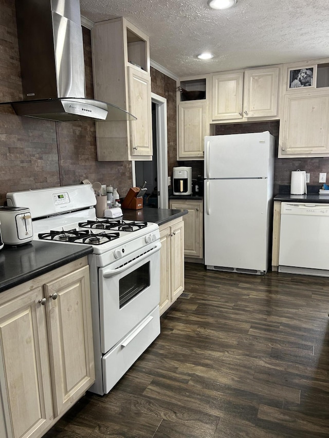 kitchen featuring white appliances, a textured ceiling, dark wood-type flooring, wall chimney range hood, and ornamental molding