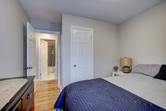 bedroom featuring a closet and light wood-type flooring