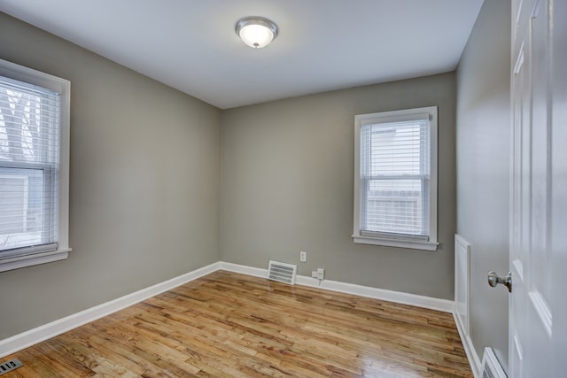 empty room with light wood-type flooring