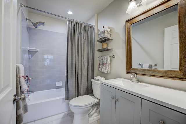 full bathroom with tile patterned flooring, vanity, shower / tub combo, and toilet