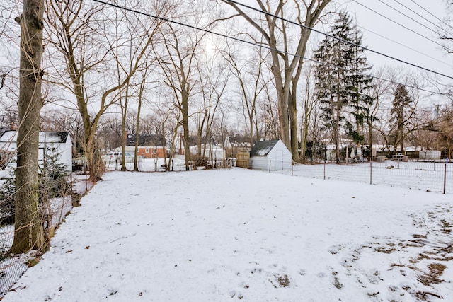 view of yard layered in snow