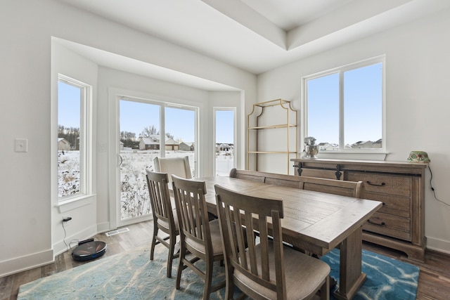 dining area with dark wood-type flooring