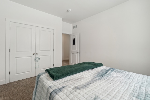 bedroom with carpet floors and a closet