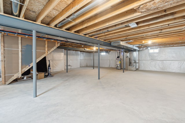 basement with gas water heater and heating unit