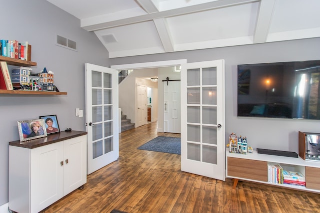 interior space featuring dark wood-type flooring, lofted ceiling with beams, and french doors